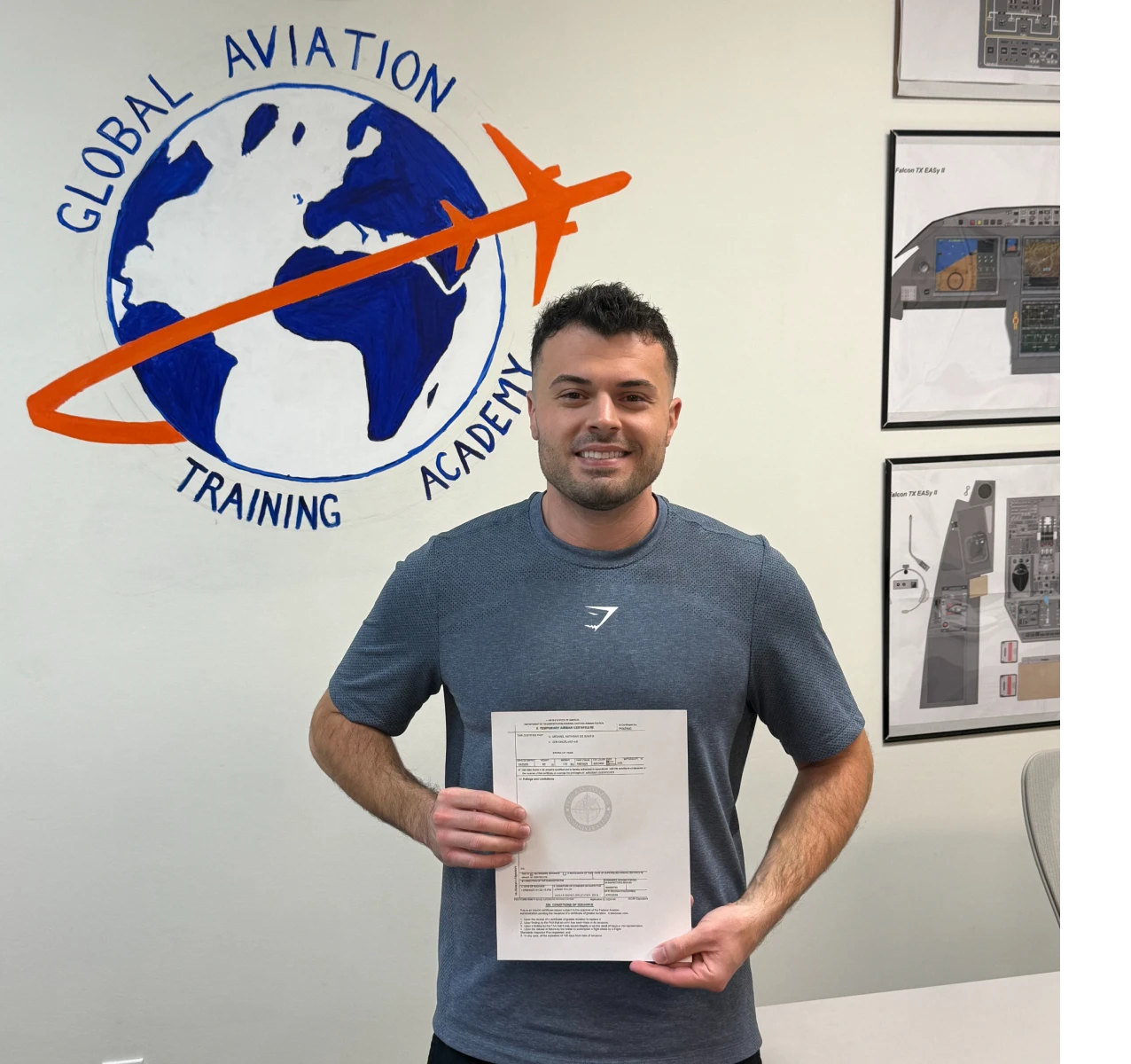 Man holding certificate at aviation academy