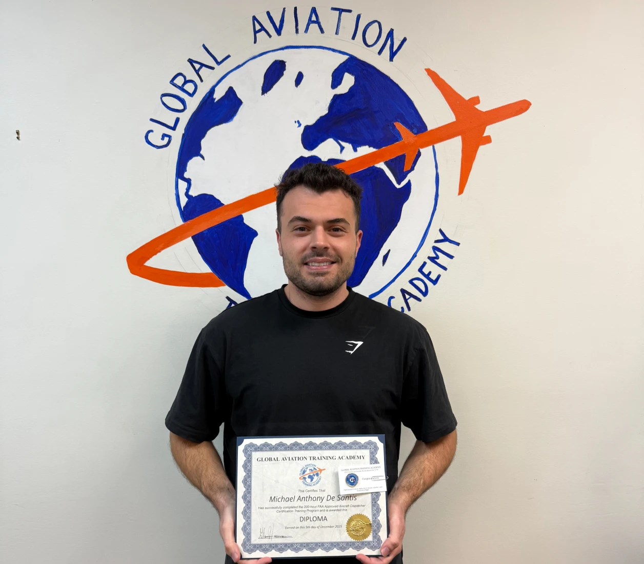 Man holding aviation diploma