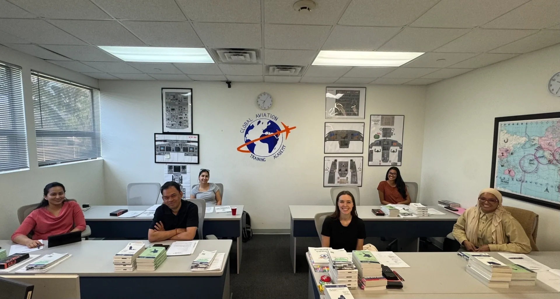 Smiling students in aviation training classroom