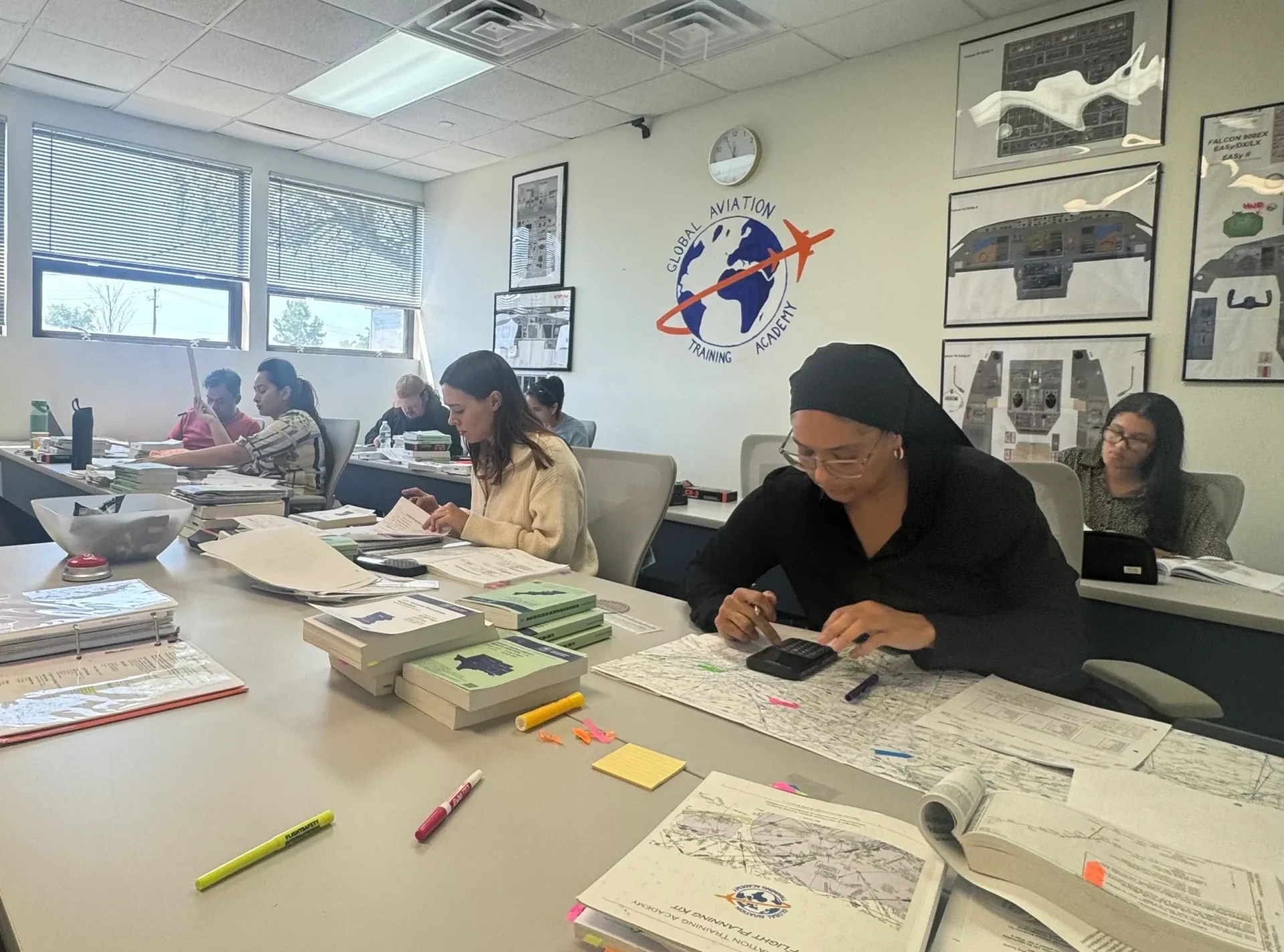 Students studying in aviation training classroom
